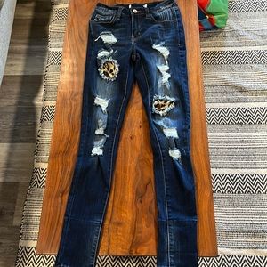 Kancan skinny Jean with rips and cheetah print
